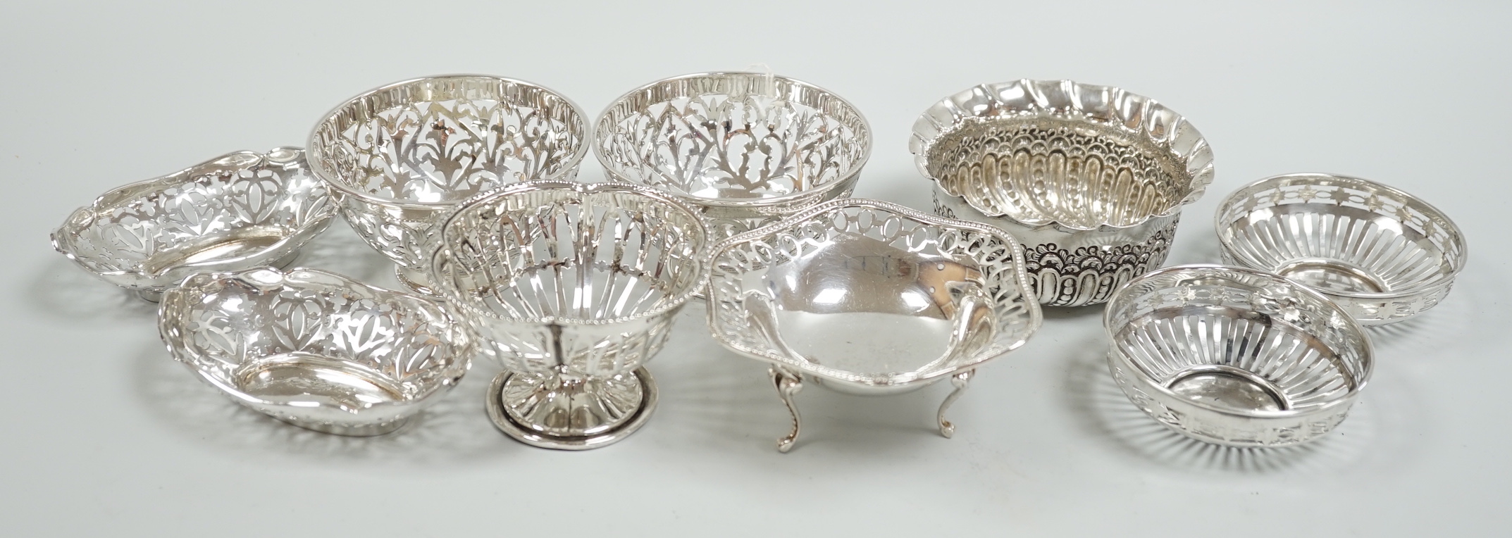 A modern pair of pierced silver sweetmeat bowls, by C.J. Vander Ltd, diameter 84mm, a pair of earlier bonbon dishes and four other silver bowls, 15.9oz.